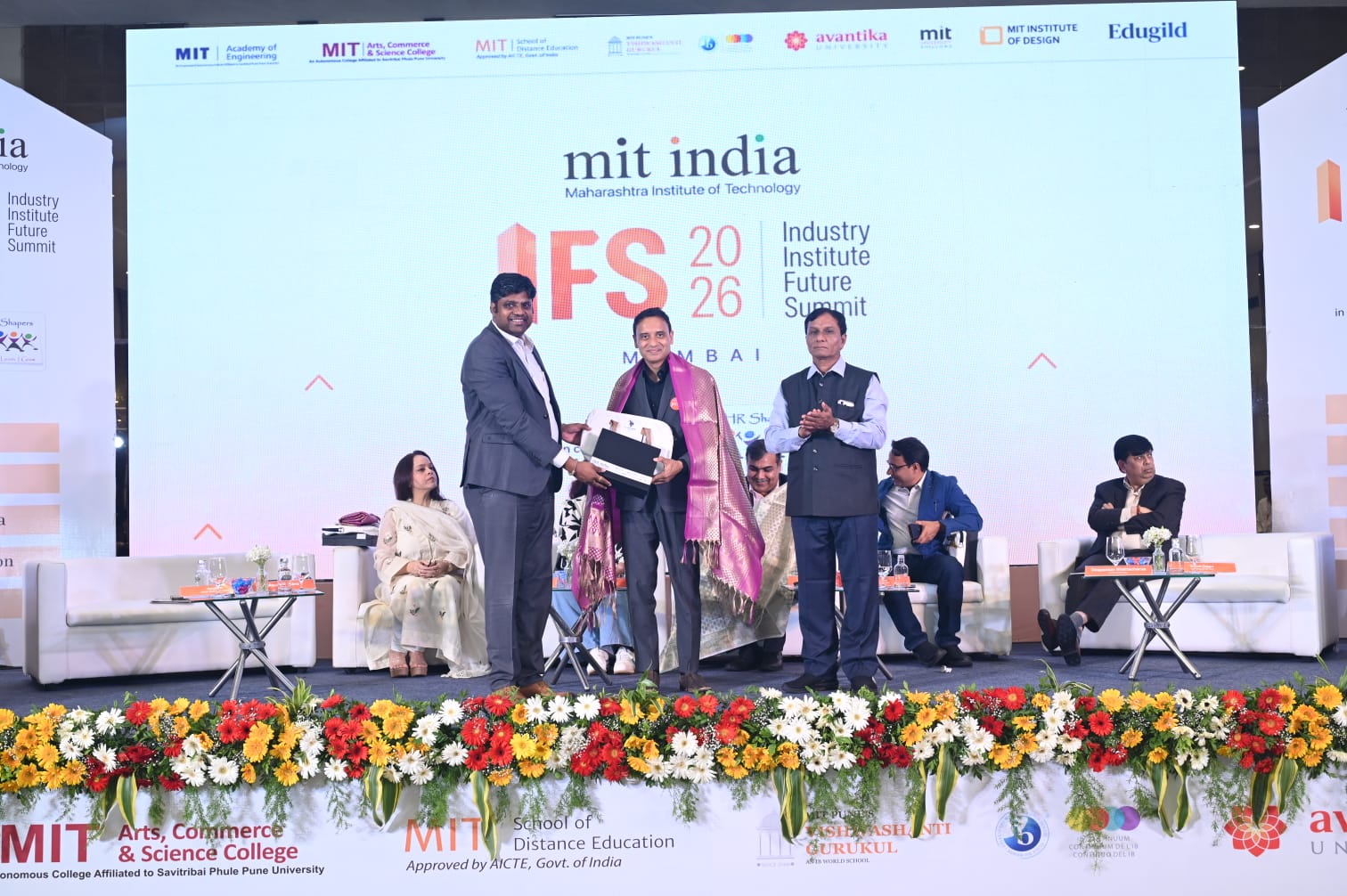 Mayank Saxena felicitated on stage at MIT India IFS 2026, Taj Lands End Mumbai